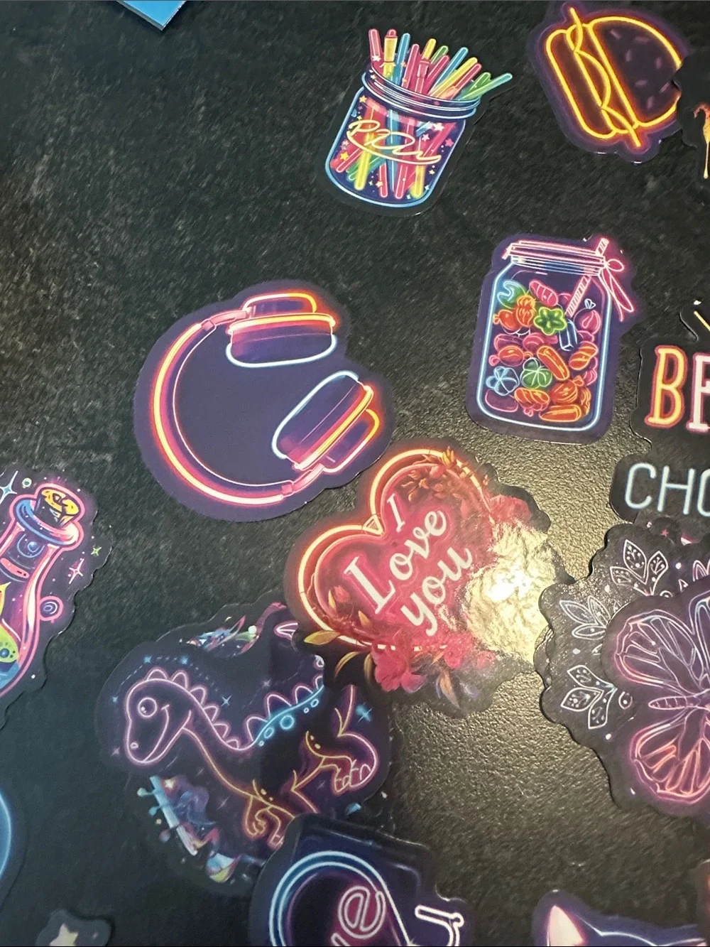 Assorted pack of stickers. Most are 2x2 inches